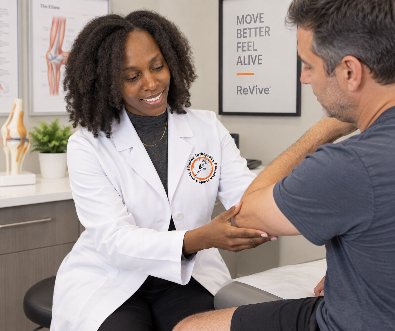 A PA discussing elbow pain and regenerative treatment options with a patient at ReVive Orthopedics
